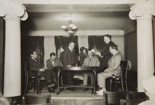 Президиум торжественного заседания по поводу 40-летнего юбилея художественной деятельности народного художника республики А.Е. Архипова. А.М. Васнецов приветствует юбиляра